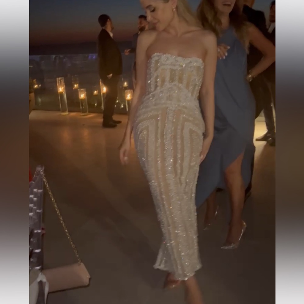 Custom made dress. Only worn for 3 hours. Has a built in corset.